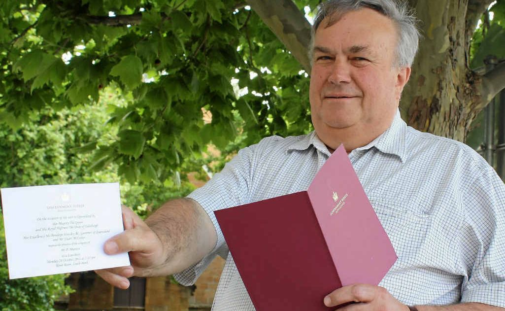 Paul Munson with the invitation requesting his attendance at a luncheon with the Queen this week.